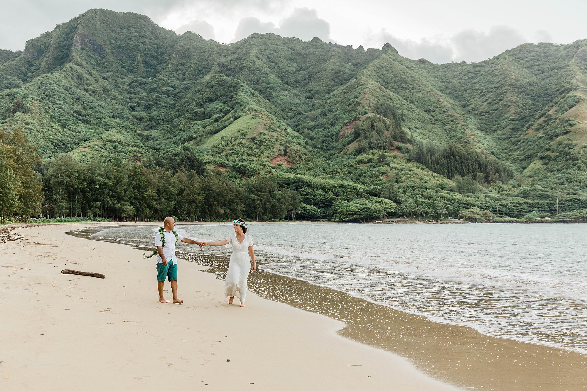 bride and groom on a beach in hawaii