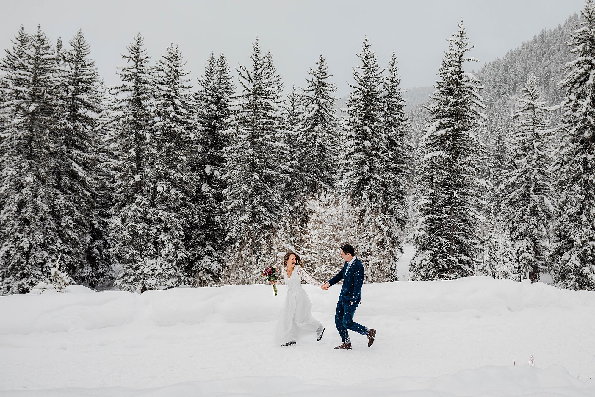 bride and groom in snowy elopement utah elopement photographer