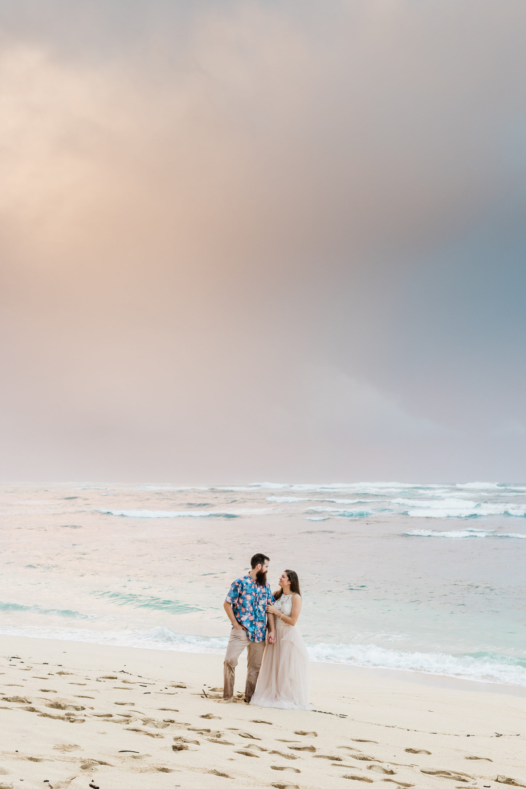 couple at sunset hawaii elopement rainy season