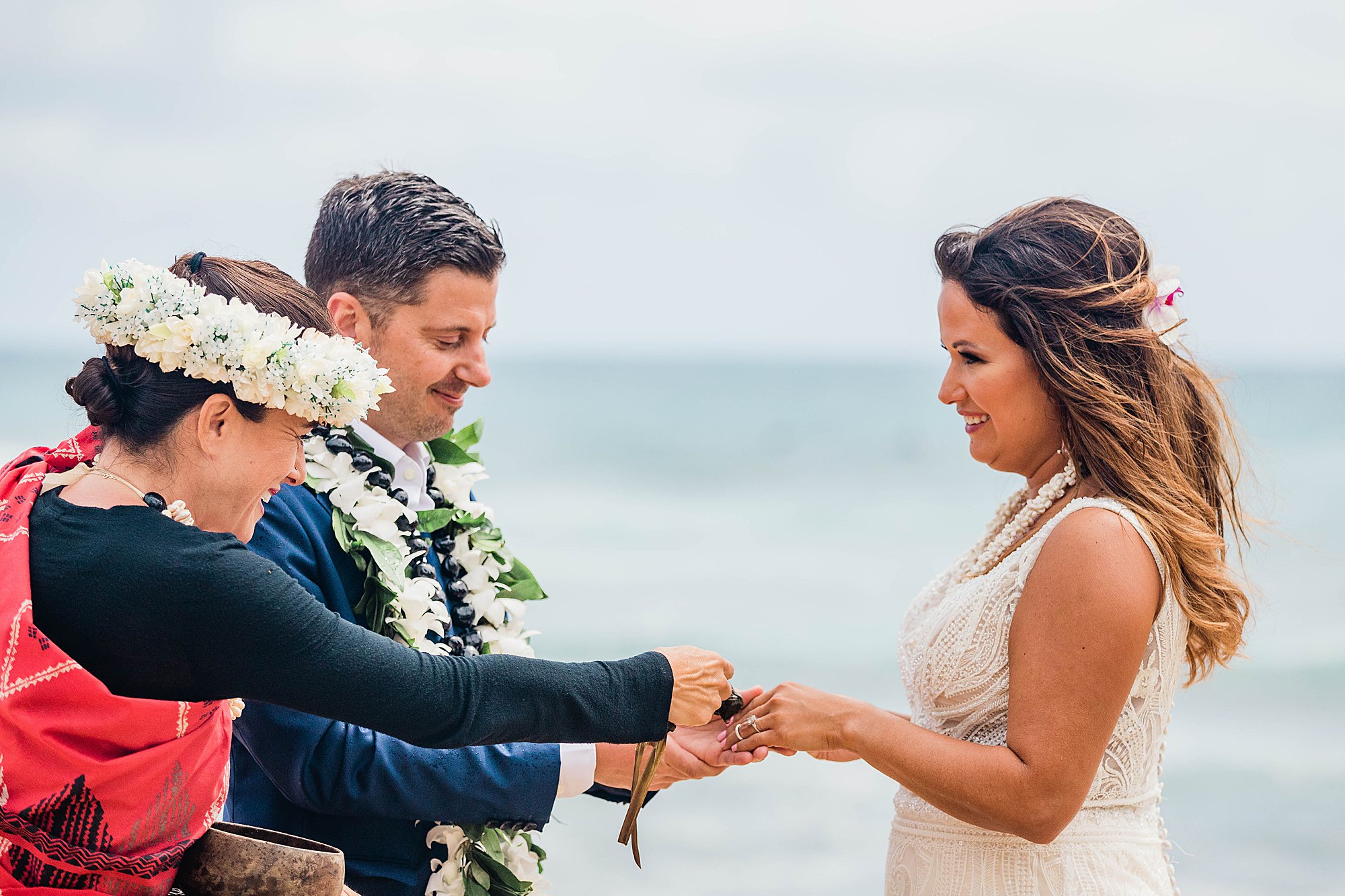 bride and groom in sandy beach wedding
