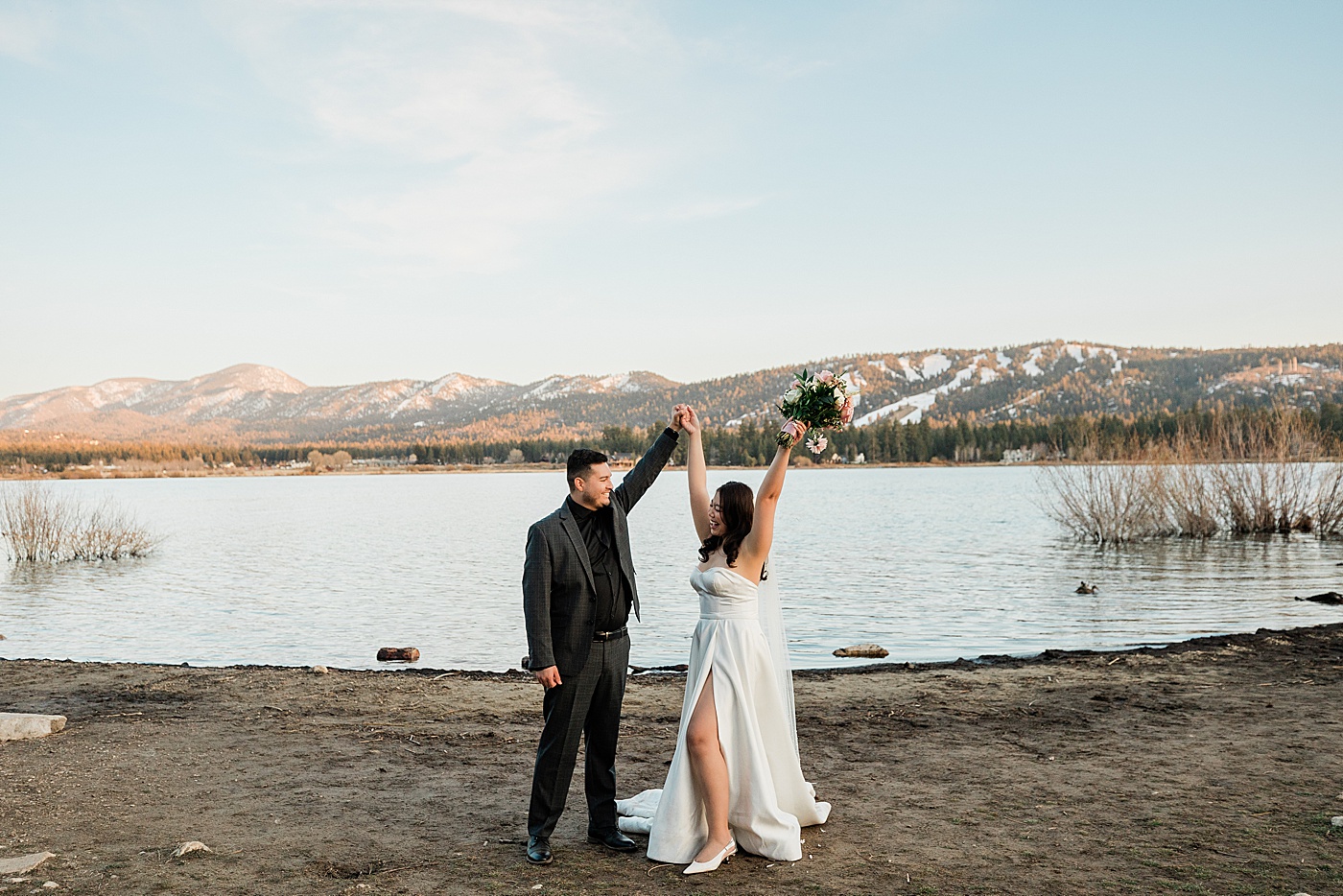 Bride and groom celebrating elopement at Big Bear Lake.