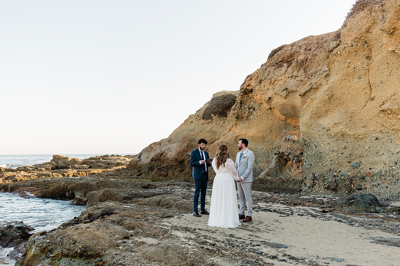 Officiant performing ceremony for bride and groom during Orange County elopement.