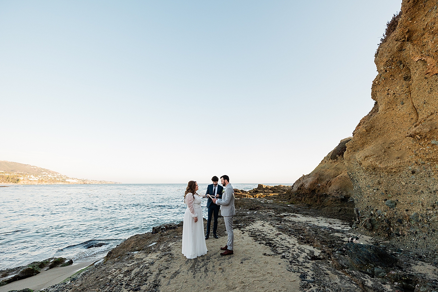 Officiant performing ceremony for bride and groom during Orange County elopement.