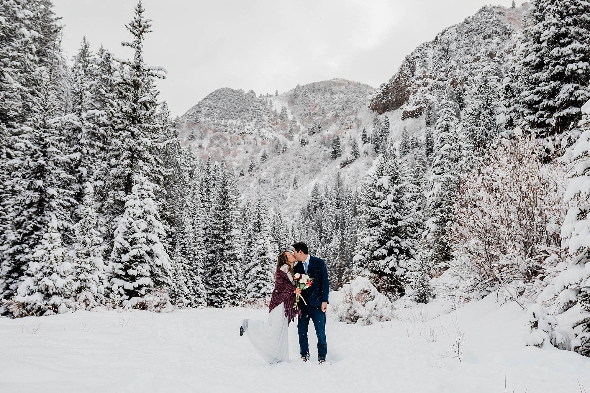 bride and groom in snowy elopement utah elopement photographer
